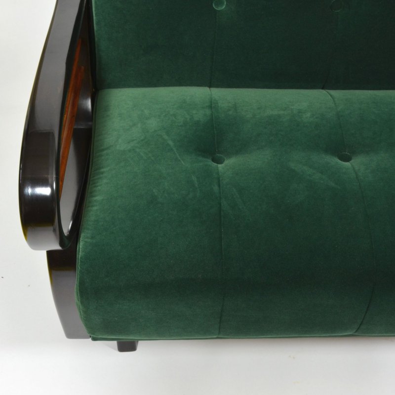 Dark green velvet sofa