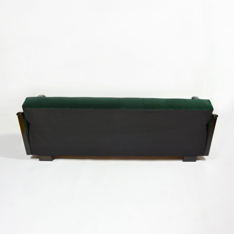 Dark green velvet sofa