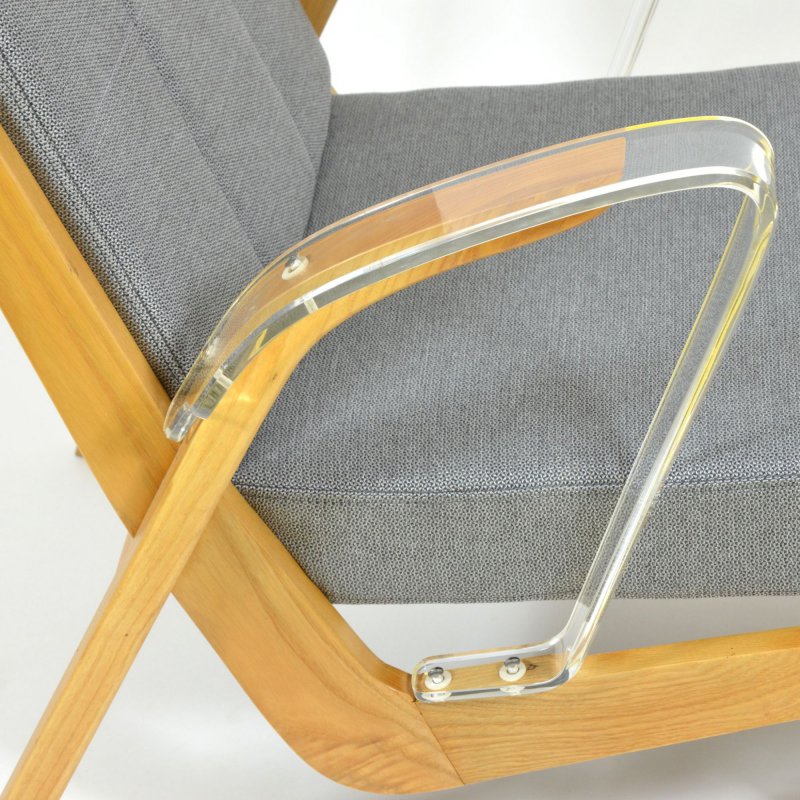 Unique retro armchair with plexiglass armrests