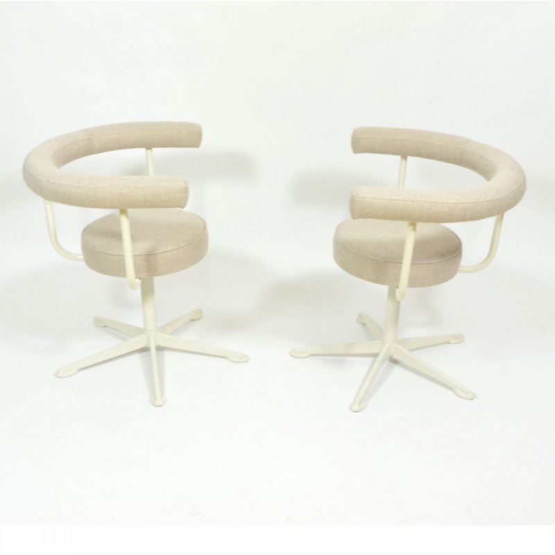 Pair of swivel chairs on metal leg