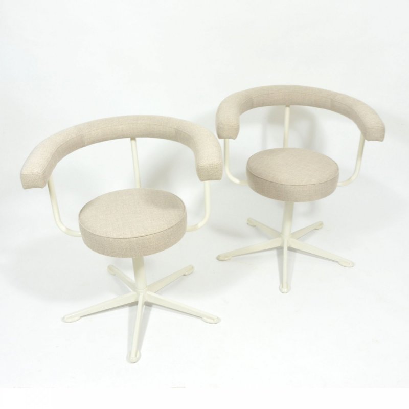 Pair of swivel chairs on metal leg